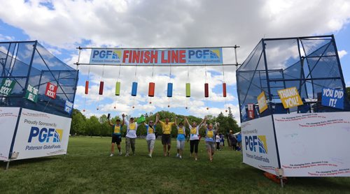 A group of people representing the Guertin, Dumesnil, Parent, Courcelles and Inman families complete the 2014 CancerCare Manitoba Challenge for Life 20k walk, Saturday, June 7, 2014. (TREVOR HAGAN/WINNIPEG FREE PRESS)