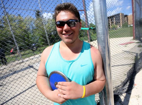 Justin Krantz from Goose Lake High School in Roblin, Manitoba, poses with a discuss during the MHSAA Track and Field Championships at the University of Manitoba, Saturday, June 7, 2014. (TREVOR HAGAN/WINNIPEG FREE PRESS) for kyle edwards story