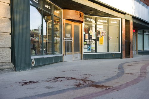 140607 Winnipeg - DAVID LIPNOWSKI / WINNIPEG FREE PRESS (June 07, 2014)  Blood spatters can be seen on the east sidewalk of Main Street between Alexander Ave and Logan Ave