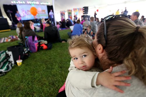 Lyla Nedelec, 19 months, takes in a concert with her mom, Rachel, at Kids Fest at The Forks, Sunday, June 8, 2014. (TREVOR HAGAN/WINNIPEG FREE PRESS)