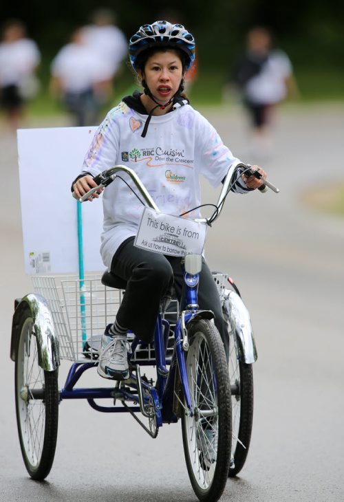 Keera Lyall, 17, participating in the Cruising Down the Crescent walkathon, raising money for Children with disabilities, Sunday, June 8, 2014. (TREVOR HAGAN/WINNIPEG FREE PRESS)