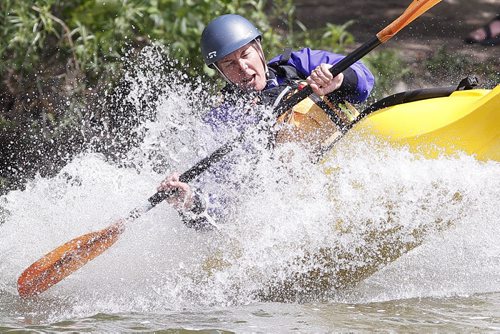 June 8, 2014 - 140608  -  Judy Wilson with the Manitoba Whitewater Club crashes into the water after sliding down a slide at the second annual Paddlefest at FortWhyte Alive Sunday, June 8, 2014. John Woods / Winnipeg Free Press