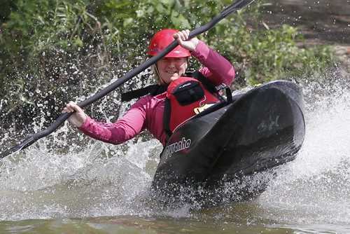 June 8, 2014 - 140608  -  Samantha Page with the Manitoba Whitewater Club crashes into the water after sliding down a slide at the second annual Paddlefest at FortWhyte Alive Sunday, June 8, 2014. John Woods / Winnipeg Free Press