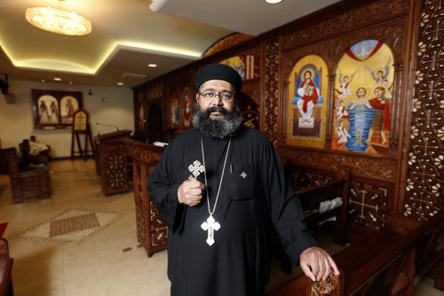 FAITH Story: Coptic pope to visit Winnipeg but no pope in pic.  St.Mark Coptic Orthodox Church, 1111 Chevrier Blvd. Subject: Father Marcos Farag, in photo along with interior of the church . June 9 2014 / KEN GIGLIOTTI / WINNIPEG FREE PRESS