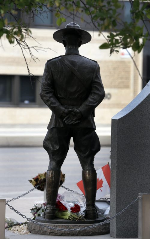 LOCAL - Wpg D Division headquarters for the RCMP memorial for RCMP officers who lost their lives on duty is adorned with flags , wreaths , flowers and messages of condolence on the day of the funerals for members killed in Moncton .  June 10 2014 / KEN GIGLIOTTI / WINNIPEG FREE PRESS