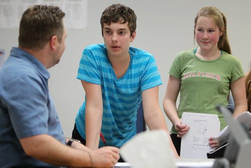 Quinn and Sarah hand in their assignments in Social Studies Class. Former Windsor School students face new challenges and take on new responsibilities in their first year in grade nine at Glen Lawn Collegiate. See Doug Speirs story.  June 04, 2014 Ruth Bonneville / Winnipeg Free Press
