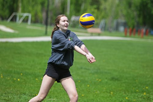 Sydney  who was captain of the volleyball team plays a pick-up game of volleyball over the lunch hour  with some of her former Windsor School friends. Former Windsor School students face new challenges and take on new responsibilities in their first year in grade nine at Glen Lawn Collegiate. See Doug Speirs story.  June 04, 2014 Ruth Bonneville / Winnipeg Free Press