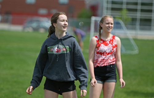 Sydney (left) who was captain of the volleyball team plays a pick-up game of volleyball over the lunch hour  with some of her former Windsor School friends (Hailey). Former Windsor School students face new challenges and take on new responsibilities in their first year in grade nine at Glen Lawn Collegiate. See Doug Speirs story.  June 04, 2014 Ruth Bonneville / Winnipeg Free Press