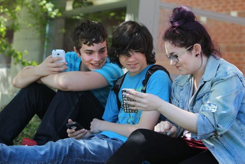 Quinn, Thomas and Shelby hang together outside the front of Glen Lawn Collegiate during a spare. Former Windsor School students face new challenges and take on new responsibilities in their first year in grade nine at Glen Lawn Collegiate. See Doug Speirs story.  June 04, 2014 Ruth Bonneville / Winnipeg Free Press