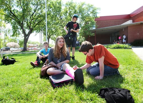 Windsor School students gather together on the front lawn  in early June during the final days of their 1st year in High School at Glen Lawn Collegiate.  This is becoming a rare gathering for the  students since many of them have made new friends now that they are in a larger school.   Names from left -  Quinn, Mackenzie, Garrett and Noah. Former Windsor School students face new challenges and take on new responsibilities in their first year in grade nine at Glen Lawn Collegiate. See Doug Speirs story.  June 04, 2014 Ruth Bonneville / Winnipeg Free Press