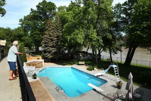 91 Shier Drive in Charleswood- Balcony off master bedroom showing outside view- pool and Assiniboine River- See Todd Lewys story- June 10, 2014   (JOE BRYKSA / WINNIPEG FREE PRESS)