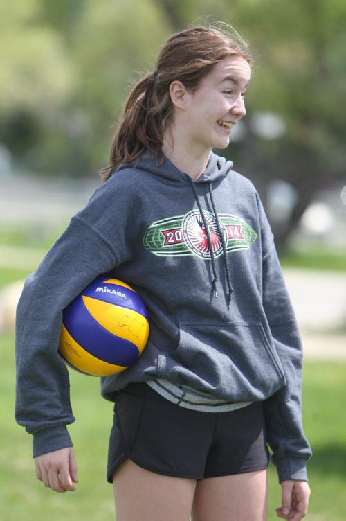 Sydney  who was captain of the volleyball team plays a pick-up game of volleyball over the lunch hour  with some of her former Windsor School friends. Former Windsor School students face new challenges and take on new responsibilities in their first year in grade nine at Glen Lawn Collegiate. See Doug Speirs story.  June 04, 2014 Ruth Bonneville / Winnipeg Free Press