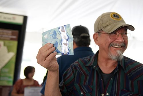 Normand Chartrand, 72, receives his first treaty payment on Tuesday morning at The Forks National Historic Site. Sarah Taylor / Winnipeg Free Press
