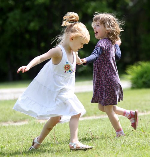 Audrey Lockhart, left, and Sophia Weiss enjoy outdoor activities to celebrate last day of school before summer at the Friends Together Preschool at St Pauls Anglican church at Point Rd and North Drive -  Standup photo- June 11, 2014   (JOE BRYKSA / WINNIPEG FREE PRESS)
