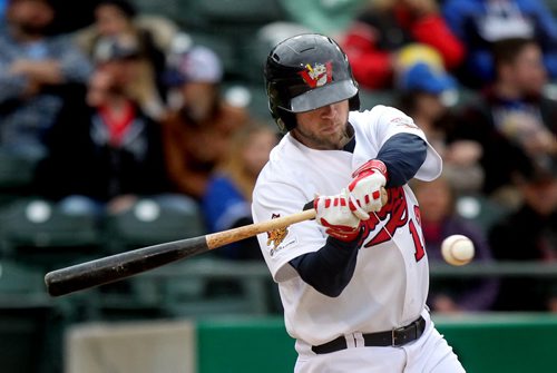 Winnipeg Goldeye first baseman #12 Casey Haerther takes a close look at an opening pitch before hitting one past the left field fence to score three runs in the bottom of the 2nd against the Grand Prairie AirHogs. June 11, 2014 - (Phil Hossack / Winnipeg Free Press)