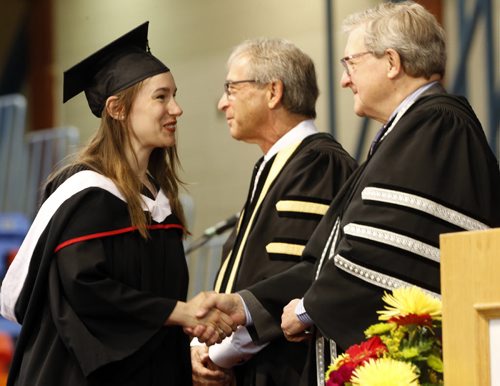 LOCAL . Emma Lewis-Sing recieved her BA fron  Lloyd Axworthy President and Vice-Chancellor  and (centre)  UofW Chancellor Robert Silver  . Former Prime Minister Jean Chretien, was honoured with  with an  honorary degree and gave the keynote address. ,  . with story June 12 2014 / KEN GIGLIOTTI / WINNIPEG FREE PRESS