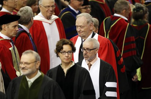 LOCAL . 103rd  UofW Convocation , Jean Chretien marches in with academic procession  to receivean  honorary degree and give the keynote  address  . with story June 12 2014 / KEN GIGLIOTTI / WINNIPEG FREE PRESS