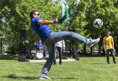 Leonardo Barros plays soccer with fellow fans at the World Cup pre game party on Thursday afternoon. Sarah Taylor / Winnipeg Free Press