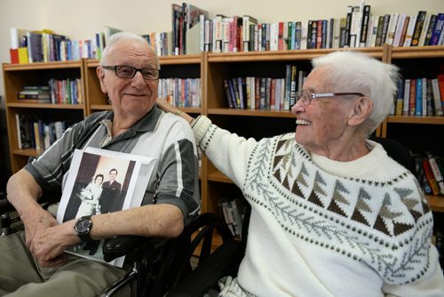 Werner Junghans holds his wedding photo next to his wife of 66 years Erna. Erna is living at Tuxedo Villa nursing home while Werner who is ill himself, lives in their home. Sarah Taylor / Winnipeg Free Press