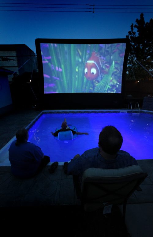 Bulldog Backyard Movies puts on drive-in style movies in customers' backyards, for b-day parties, etc. Earl has an inflatable screen - it's 13' by 20' - that he projects movies onto. See Dave Sanderson's tale. June 12, 2014 - (Phil Hossack / Winnipeg Free Press)