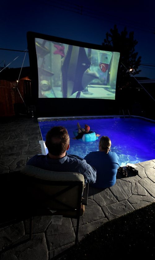 Bulldog Backyard Movies puts on drive-in style movies in customers' backyards, for b-day parties, etc. Earl has an inflatable screen - it's 13' by 20' - that he projects movies onto. See Dave Sanderson's tale. June 12, 2014 - (Phil Hossack / Winnipeg Free Press)