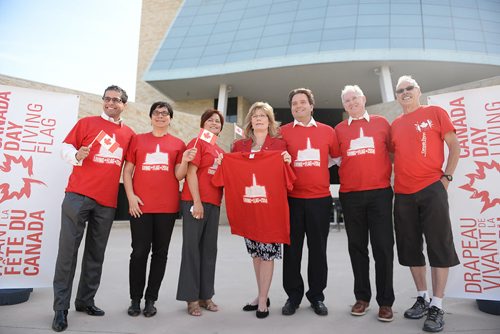 Chair of management board at Downtown Winnipeg BIZ Sachit Mehra, councillor Jenny Gerbasi, minister of multiculturalism and literacy Flor Marcelino, minister of Canadian heritage and official languages Shelly Glover, executive director of Downtown Winnipeg BIZ Stefano Grande, president and CEO of Canadian Museum for Human Rights Stuart Murray and volunteer Grant Nazarko stand outside the Human Rights Museum for the Canada Day Living Flag press conference. Sarah Taylor / Winnipeg Free Press