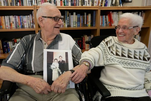 Werner Junghans holds his wedding photo next to his wife of 66 years Erna. Erna is living at Tuxedo Villa nursing home while Werner who is ill himself, lives in their home. Sarah Taylor / Winnipeg Free Press