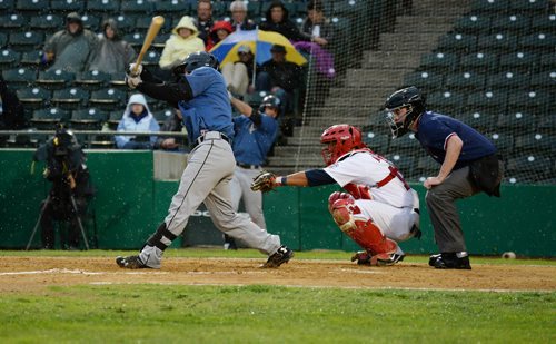 St. Paul Saints' Sam Maus misses a hit from the Goldeyes. The game got delayed from the rain shortly after. Sarah Taylor / Winnipeg.
