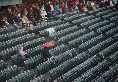Fans wait for the Goldeyes game to resume after the rain delay. Sarah Taylor / Winnipeg Free Press