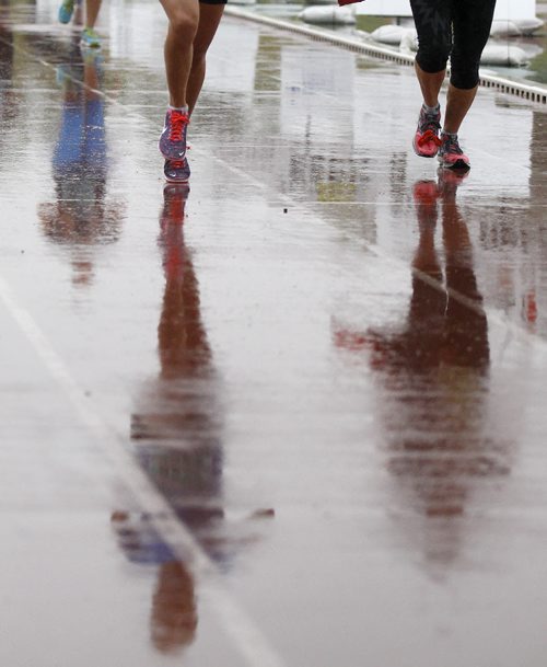 Reflection of half marathon participants at the Manitoba Marathon at the University of Manitoba, Sunday, June 15, 2014. (TREVOR HAGAN/WINNIPEG FREE PRESS)