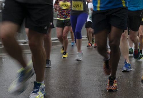 Runners head over the Elm Park Bridge an hour into the marathon. Sarah Taylor / Winnipeg Free Press