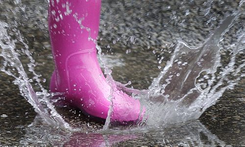 June 15, 2014 - 140615  -  Suzy Willig runs through puddles at The Ex Sunday, June 15, 2014. John Woods / Winnipeg Free Press