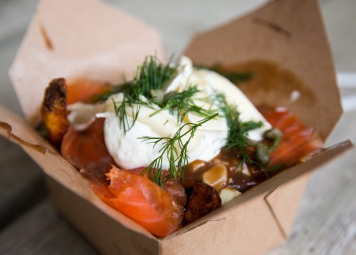 The Fisherman poutine at the Poutine King truck. Traditional poutine topped with smoked salmon, brie, sour cream, fresh dill and capers. Red River Ex food reviews - Jen Zoratti story 140613 - Friday, June 13, 2014 - (Melissa Tait / Winnipeg Free Press)