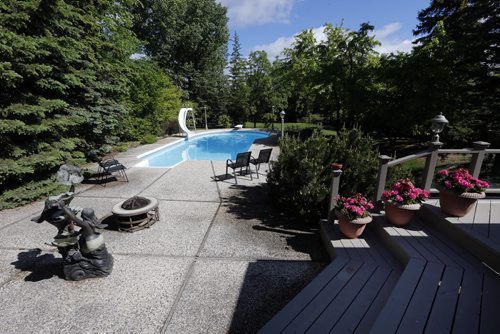 backyard pool and decks -HOMES . 6383 Southboine Dr.  Story by Todd Lewys June 16 2014 / KEN GIGLIOTTI / WINNIPEG FREE PRESS