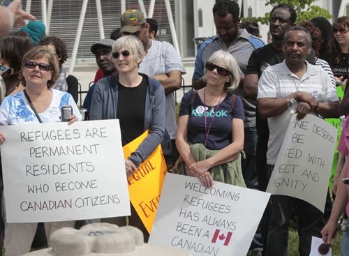 About a hundred took part in the Walk with Refugees for a Stronger Canada. the walk was a guided tour highlighting significant places and stories for refugees, former refugees and others seeking protection in our city. The walk returned to Central Park for a rally in support of services for and protection of refugees. Carol Sanders story Wayne Glowacki/Winnipeg Free Press June 16 2014