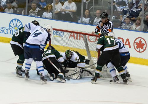 Texas Stars goaltender Cristopher Nilstrop tries to cover the puck during a scramble in front of the net at Mile One Centre Monday night.  Photo by Keith Gosse/The Telegram