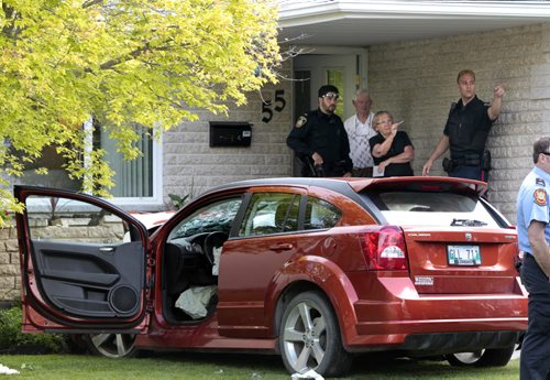 A car travelling on Lonsdale Dr. crashed into the planter in front of a home at 55 Kirby Dr. Tuesday morning sending the driver to the hospital. Possible medical condition may have  been the cause. Wayne Glowacki/Winnipeg Free Press¤¤may 17 2014