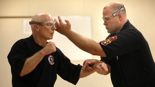 Former Winnipeg Blue Bomber Brett MacNeil (right) demonstrates while training/teaching the martial art Wing Chun Do, which was created by Bruce Lee. MacNeil is in his 10th year as an instructor of this martial art. See Ashely Prest story. June 217, 2014 - (Phil Hossack / Winnipeg Free Press)