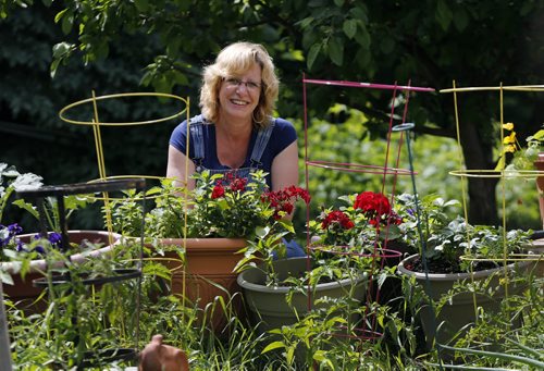 Urban  Farmers Green Page , Nancy Blokland grows food , herbs and flowers all over her yard. Story by  Alexandra Paul   June 18 2014 / KEN GIGLIOTTI / WINNIPEG FREE PRESS