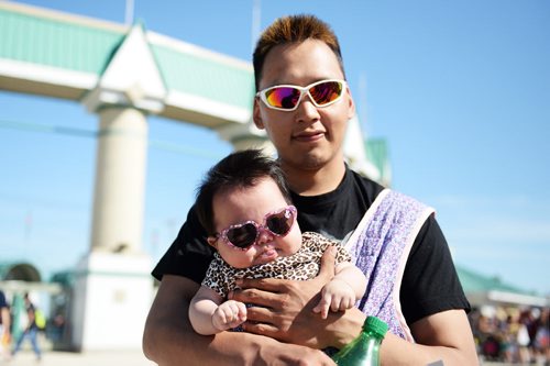 Three month old Janaiya with her father Matthew Issumatardiuak at the Red River Ex. Sarah Taylor / Winnipeg Free Press