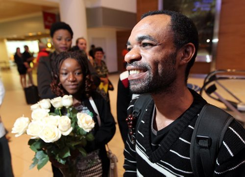 Happy and free Quesney Ramazani and his daughter Lauraine arrived in Winnipeg Wednesday evening. See Alex Paul story. June 18, 2014 - (Phil Hossack / Winnipeg Free Press)