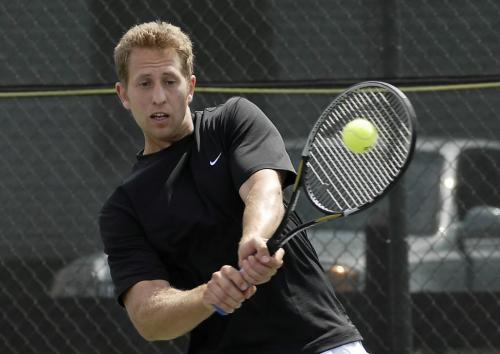 Winnipeger Doug Devriendt smashes the ball during his match against Trevor Borland in the second round of the Manitoba open Friday at the Kildonan Tennis Club.   Doug has been ranked #1 in Manitoba since 1998 and has captured the Mens's Singles title five times.  Photo by Aaron Vincent Elkaim winnipeg free press