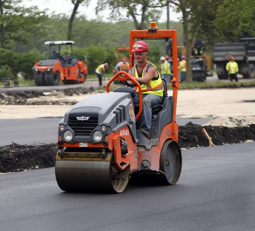 The Assiniboine Park Zoo gets newly paved parking lot  at it's main entrance on Roblin Blvd   in time for the opening of the Journey to Churchill  polar bear exhibit .The Zoo will be closed for ten days starting June 23 in preparation for the official opening . . June 19 2014 / KEN GIGLIOTTI / WINNIPEG FREE PRESS