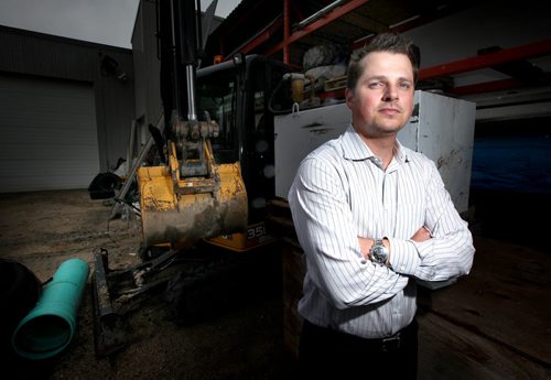 M & L in big contract dispute with MB Housing over a big renovation project. Reece Tomlinson is CEO of M & L. He's posing in the company's equipment yard. See Martin Cash story.  June 19, 2014 - (Phil Hossack / Winnipeg Free Press)