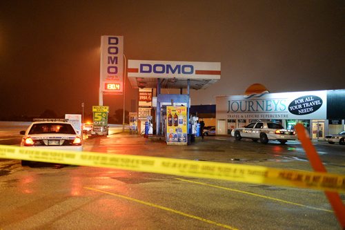 Police block off Domo gas station at 317 Wardlaw Avenue Thursday night after a shooting. Sarah Taylor / Winnipeg Free Press