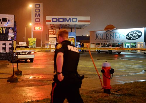 Police block off Domo gas station at 317 Wardlaw Avenue Thursday night after a shooting. Sarah Taylor / Winnipeg Free Press