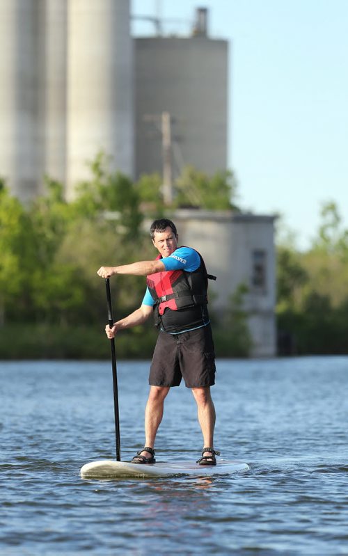 Allan Horne takes part in a WAVpaddling stand-up paddle-boarding lesson at the FortWhyte Alive Adventure Site in Winnipeg, Man., on Wed., June 18, 2014. Photo by Jason Halstead/Winnipeg Free Press RE: Intersection feature