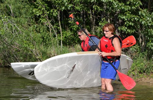 Barb Smith (right) and Janine Leblanc take to the water in a WAVpaddling stand-up paddle-boarding lesson at the FortWhyte Alive Adventure Site in Winnipeg, Man., on Wed., June 18, 2014. Photo by Jason Halstead/Winnipeg Free Press RE: Intersection feature