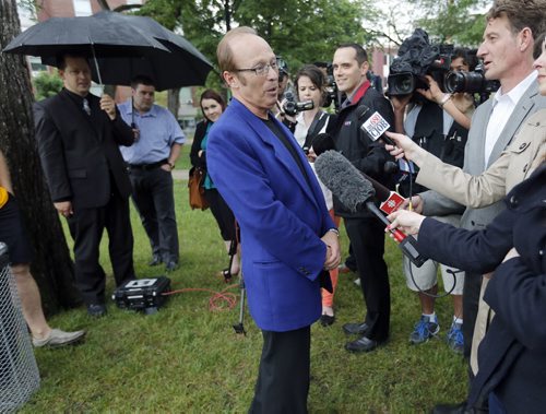 Sam Katz fields question after his announcement with his staffers looking on .  Mayor Sam Katz announces he will not run for another term as mayor of the city of Winnipeg  at a Central Park  scrum.  June 20 2014 / KEN GIGLIOTTI / WINNIPEG FREE PRESS