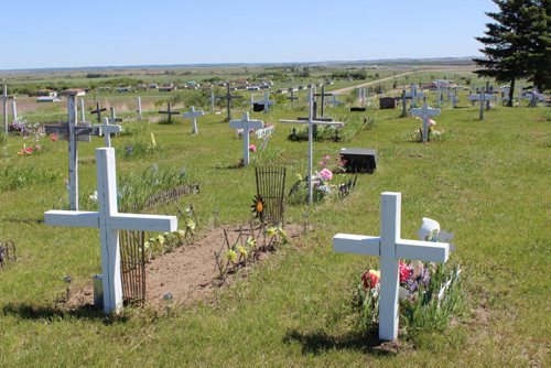 625 - 627 A view of the Anglican cemetery in Sioux Valley Dakota Nation, where many of the grave markers are white, wooden crosses. BILL REDEKOP/WINNIPEG FREE PRESS June 13,2014